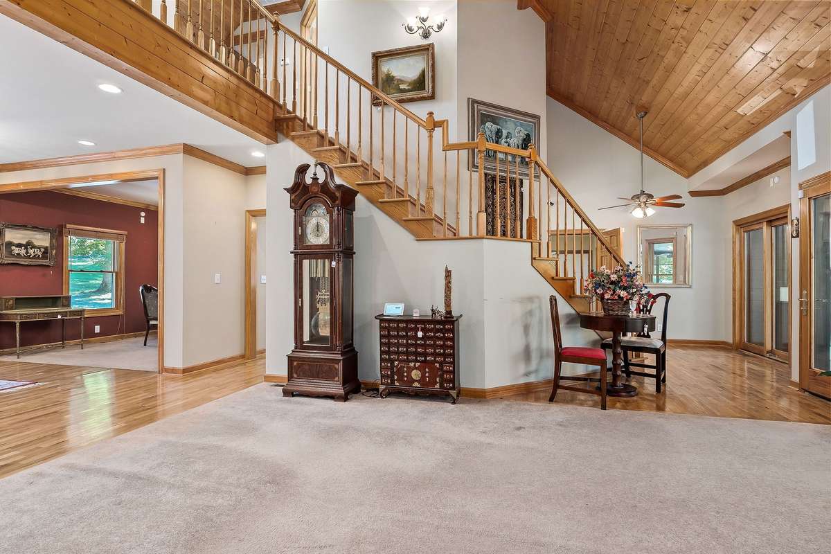The beautiful hardwood steps lead upstairs, where there are two bedrooms, a full bathroom and another room that could be used as a playroom, office, etc.