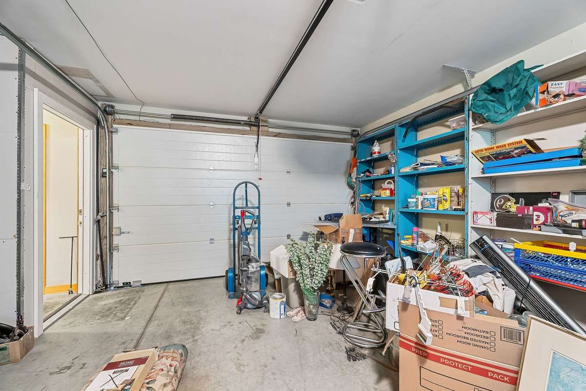 The one-car garage that leads into the kitchen area.