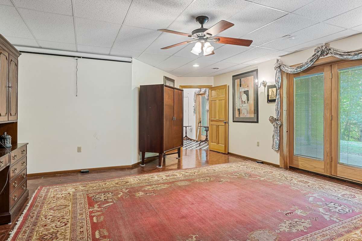 Notice the natural light coming in from the large double doors in the downstairs den.
