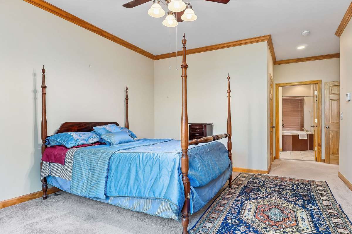 The second view of the primary bedroom shows the entrance to the primary bathroom.