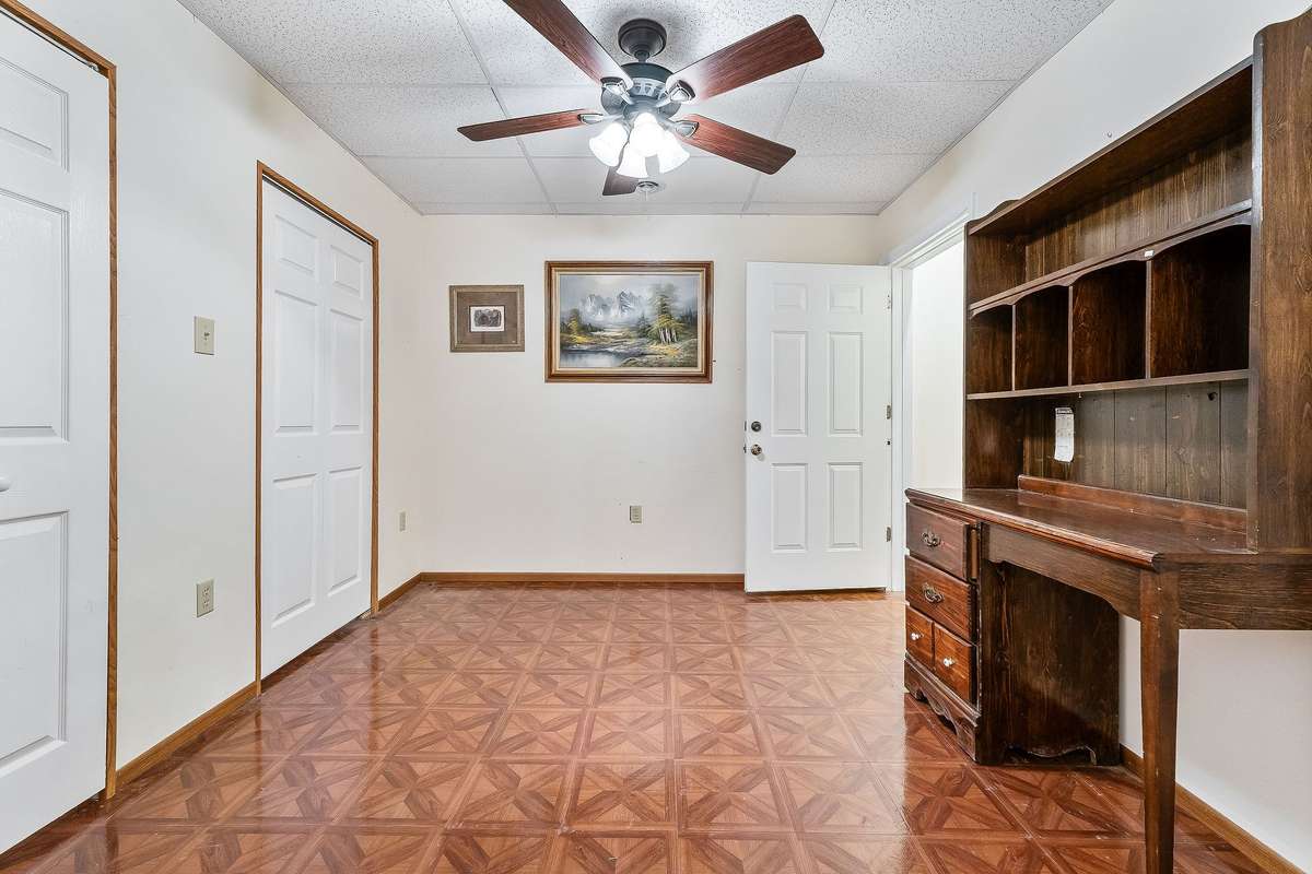 This large downstairs room is set up as an office.  It features two closets.