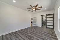 Master Bath behind frosted glass barn door