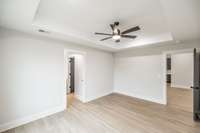 Primary bedroom has tray ceiling~