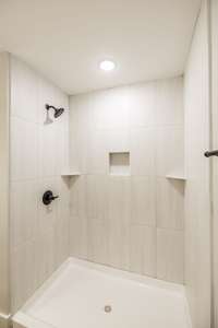 Walk in tile shower in primary bath~