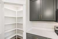 Pantry provides so much storage and upgraded wood shelving~
