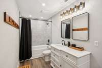 Guest Bathroom with Tile Shower/Tub Combo & Door to Backyard/Pool