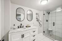 Updated Basement Bathroom with Tile Shower with Glass Door.
