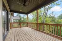 Charming covered porch off the main floor, complete with a ceiling fan for added comfort