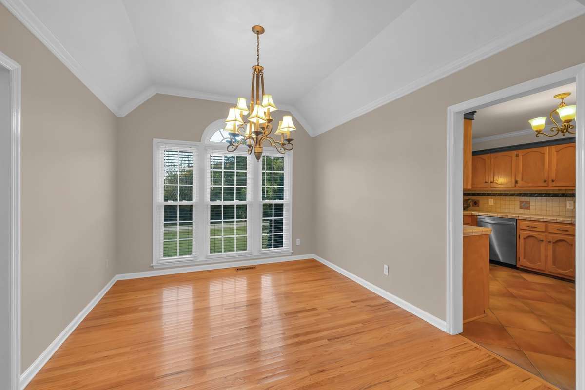 Formal Dining Room features hardwood flooring and open to the Great Room, convenient to the Kitchen.