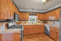 Plenty of cabinet storage, Built-in pantry, Stainless appliances includes a gas stove (and electric hook up) .