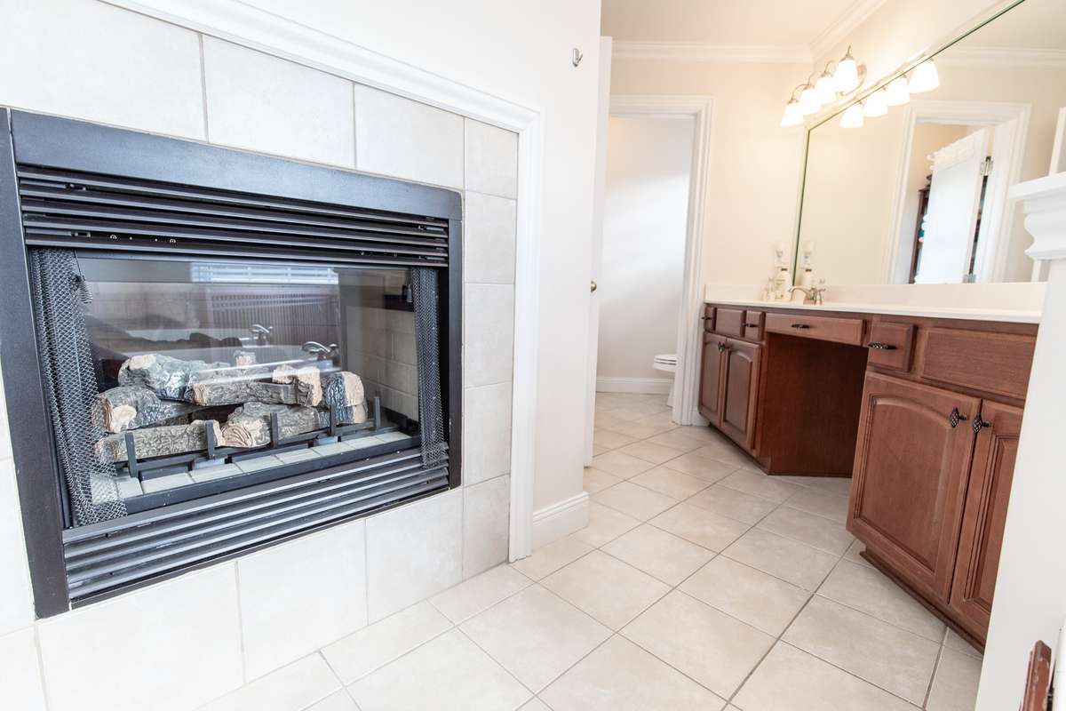 The gas fireplace that is shared with the primary suite