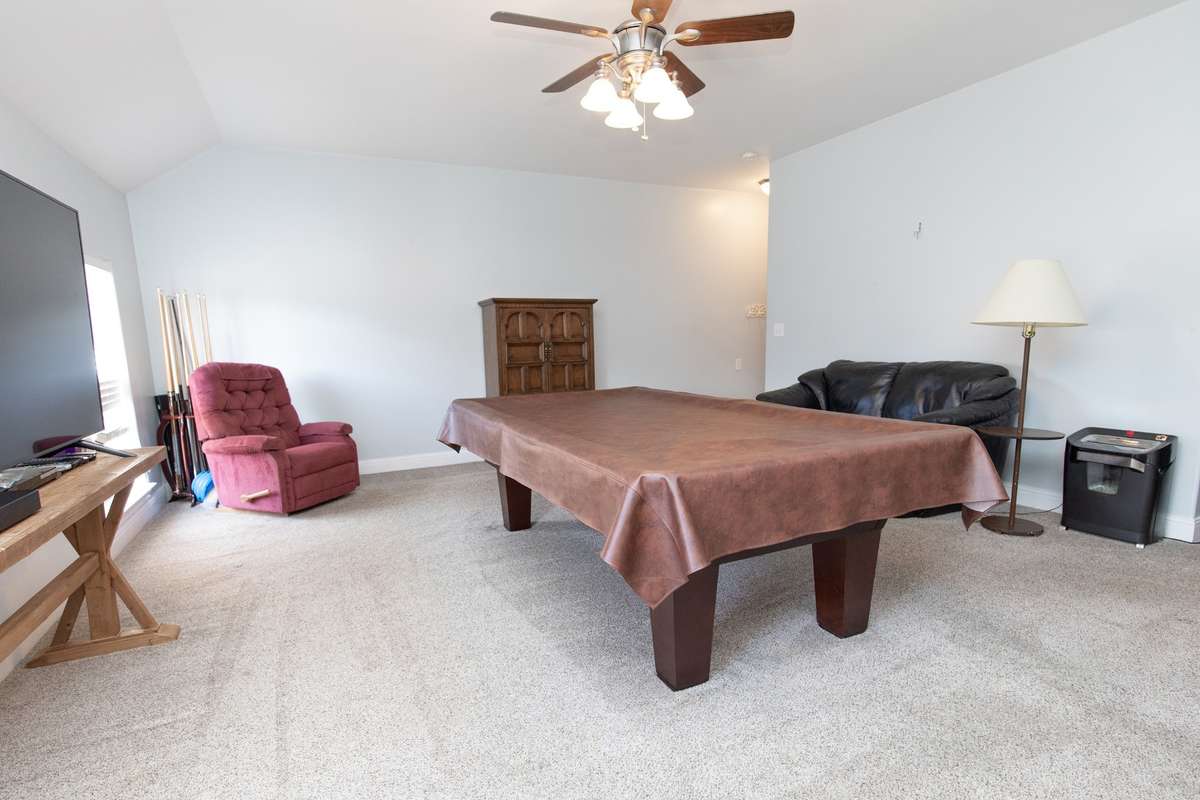 The bonus room is spacious and can be used in many ways.  This owner used it for shooting pool, an office as well as TV viewing