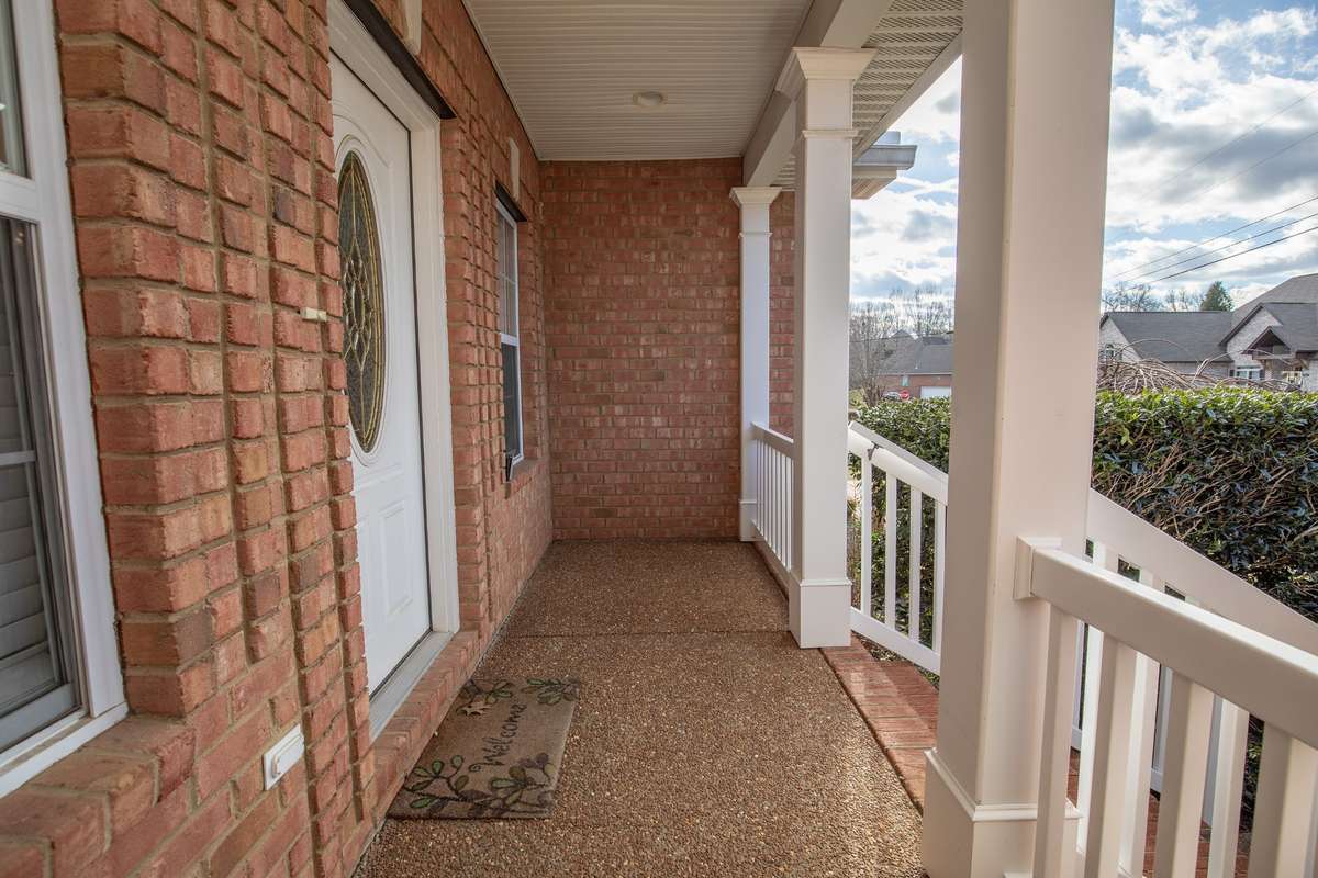 The front porch offers space for a couple of chairs or a swing