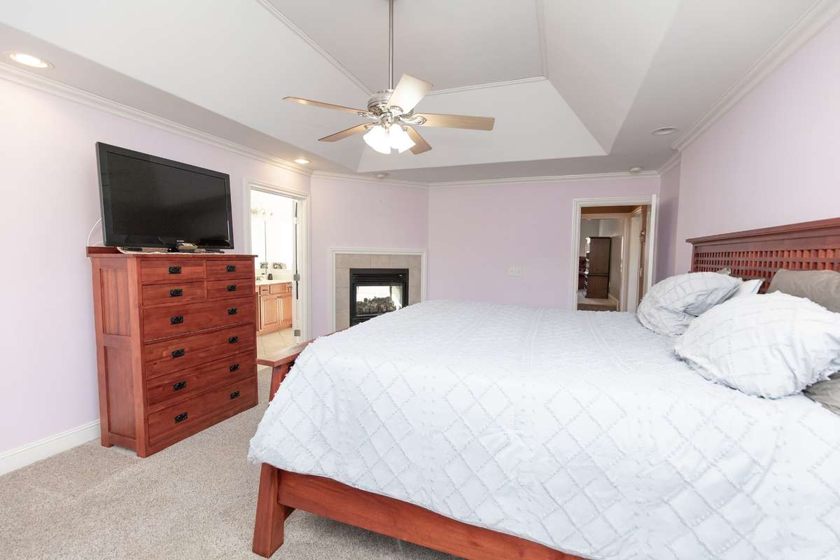 The opposite side of the primary looking at the gas fireplace and bathroom