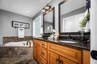 The primary bath features a walk-in closet, double vanities and a separate shower and tub.