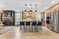 Gorgeous gourmet kitchen features double wall ovens, 42" upper cabinets, quartz countertops, and ceramic tile backsplash. Choose between 3 layouts at NO COST!