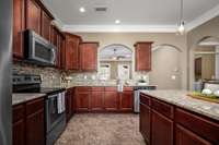 Granite countertops and recessed lighting.