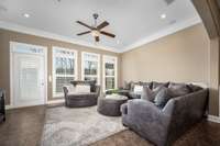 Tile floor, crown molding, surround sound, ceiling fan, recessed lighting and plantation shutters. Perfect!