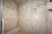 Tile shower with bench.