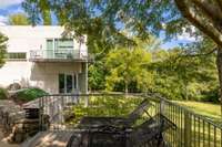Upper balcony overlooking the conservation-protected grounds, offering a peaceful outdoor retreat.