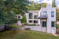 Rear elevation highlighting clean modern lines and multiple outdoor living terraces.