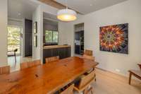 There are beautiful views out the floor-to-ceiling windows in the dining area providing a picturesque setting.