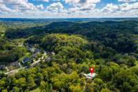 Aerial perspective illustrating Zen Hollow’s secluded setting within Natchez Bend Estates, surrounded by rolling hills, mature tree canopy, and conservation-protected land, offering privacy while remaining close to Nashville amenities.