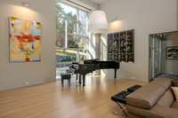 Great room configured as an acoustically engineered recording and performance space with exceptional natural light.