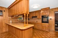 Kitchen- Wood flooring, wood cabinetry