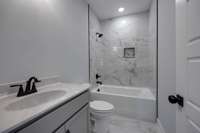 This is not a photo of the actual listing, but is another build of the same plan.