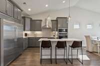 The large island frames our gourmet kitchen beautifully with generous cabinet space + walk-in pantry!