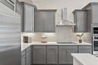 The large island frames our gourmet kitchen beautifully with generous cabinet space + walk-in pantry!