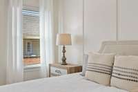 Tucked in the rear on the main level, retreat to the tranquil primary suite with large bath + walk-in closet...