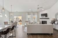 Entertain in the spacious great room, seamlessly connecting the dining area + well-appointed kitchen.