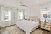 Tucked in the rear on the main level, retreat to the tranquil primary suite with large bath + walk-in closet...