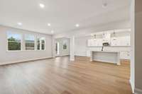 Enjoy peaceful, unobstructed views from the main living area, with large windows that frame the private backyard setting. The natural light and scenery create a warm and inviting atmosphere.