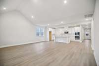 Beautiful LVP flooring runs throughout the main living areas, providing a durable foundation with a modern, unified feel.