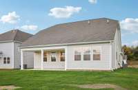 This expansive yard flows seamlessly from the covered patio, perfect for enjoying time outdoors with family and friends.