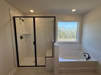 ***Photo taken on 12/12/25 to show current status of construction - pardon our dust***

Primary Bathroom Shower and Tub