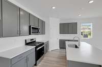 This is a photo of one of our model homes. Please know that some of the exterior and interior finishes, paint, and features may vary.