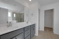 This is a photo of one of our model homes. Please know that some of the exterior and interior finishes, paint, and features may vary.