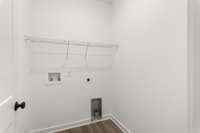 Spacious laundry room convenient to bedrooms! Photo of similar home.