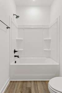 Guest bathroom. Photo of similar home.