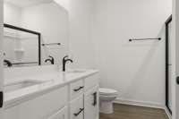 Love the finishes in your spacious primary bathroom!