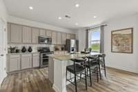Open kitchen and island
(furnished model home photo)