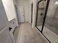 En-suite bathroom with dual vanities.