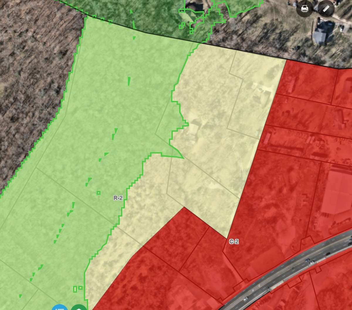 The non-red area is zoned residential. The shaded green area is the Hillside Overlay area.