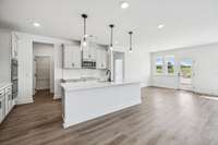 ***Photo from previously built home - options and colors may vary***

The island provides bar top seating for quick meals. We have also included pendant lights over the island as an added design element.
