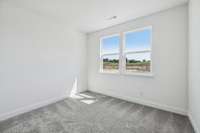 ***Photo from previously built home - options and colors may vary***

Located on the 1st floor is a Guest Retreat (Bed #5). This Bedroom measures 11' x 10' and is perfect for multi-generational living or for visitors.