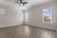 Primary bedroom with lots of windows for extra light